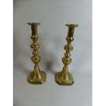 A Pair of Victorian Brass Candle Sticks with Pushers,