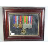 A Cased Set of WWII Medals and North Staffordshire Regiment Badge