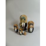 A Five Section Russian Style Doll Decorated with the Beatles and a Guitar