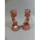 A Pair of Art Deco Pink Glass Candle Sticks in the Form of Kneeling Maidens,