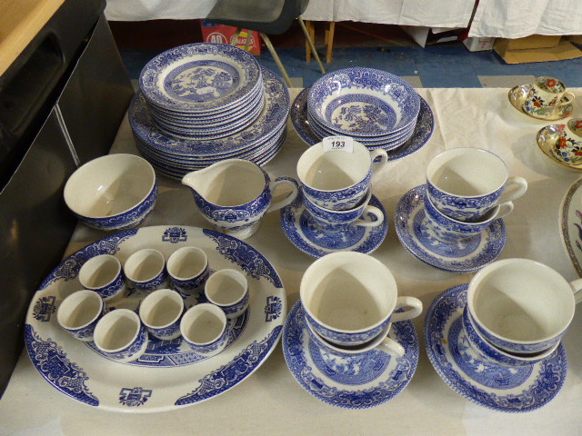 A Collection of Blue and White Willow Pattern Kitchen Wares to Include Dinner Plates, Side Plates,