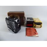 A Leather Cased Siemens Clockwork 16mm Cine Camera with Original Instruction Booklet and Seven Film