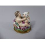 A Small Continental Porcelain Box in the Meissen Style Depicting Cupid with Lamb