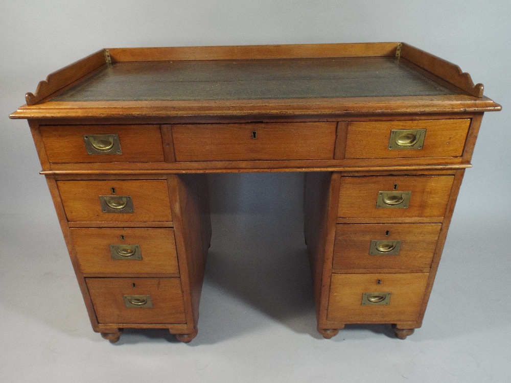 A Late Victorian Mahogany Twin Pedestal Campaign Desk by Arthur Foley and Son,