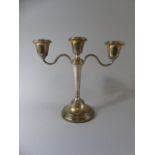 A Silver Weighted Three Branch Candelabra.