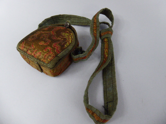 An Oriental Metal Cased Icon Containing Figure of Seated Buddha Set in Silk Embroidered Carrying