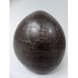 A 19th Century Carved Coconut Shell Decorated with three Masted Royal Navy Ship and Church and