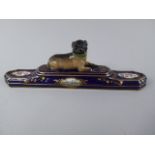 A 19th Century Dresden Porcelain Study of a Recumbent Pug Dog on Cobalt Blue and Gilt Plinth