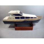 A Large Wooden Model of a Power Boat with Electric Engine and Radio Control Stering (No Control)