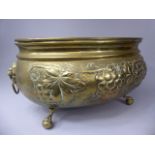 A Large Ovoid Brass Jardiniere Decorated in relief with Grapes and Vines.