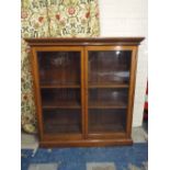 A Late Victorian Oak Glazed Bookcase with Five Adjustable Shelves.