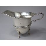 A Silver Cream Jug with Wavy Rim on Pad Feet. Birmingham Export Mark. 1928. 73.8gms.