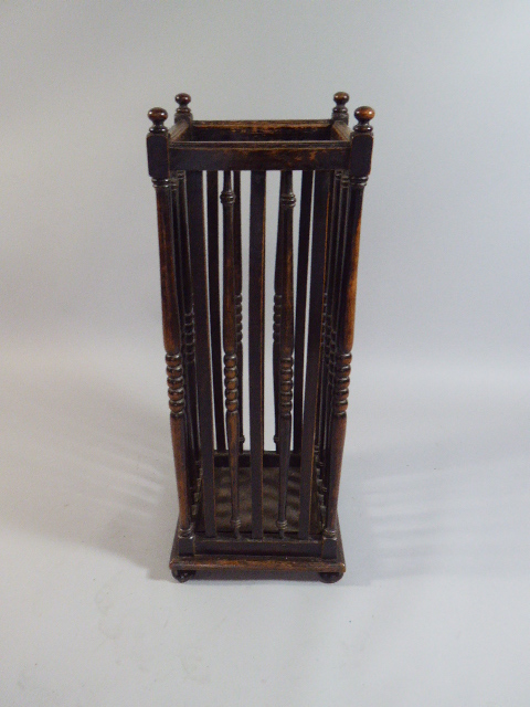 A Late 19th Century Arts and Crafts Oak Umbrella Stand with Slender Turned Spindles.