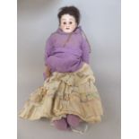 An Armand Marseille Bisque Head Doll with Shoulder Plate Head and Leather Covered Body.