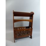 A Late 19th Century Arts and Crafts Walnut Book Stand with a Carved Stylized Foliate Panel in the