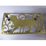 A Indian Brass Rectangular Trivet with Tiger Decoration to Pierced Top and Four Claw Feet