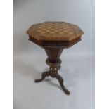 A Victorian Walnut Octagonal and Parquetry Topped Sewing Table.