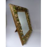 A Victorian Easel Backed Mirror with Carved and Moulded Decoration to Frame Depicting Flowers,