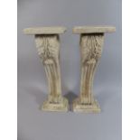 A Pair of Weathered Composition Pedestals in the Style of William Kent.