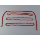 A Collection of Four Coral Necklaces.