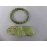 A Pierced and Carved Green Jade Bangle, 7cm Diameter and a Carved Jade Amulet. 8.