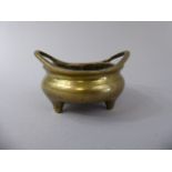 A Miniature Oriental Bronze Censer with Two Handles and Three Feet.