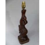 A Continental Wooden Folk Art Grotesque Carved Table Lamp.