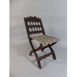 A 19th Century Carved Oak Folding Chair with Tapestry Seat