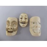 A Collection of Three Japanese Miniature Carved Ivory Noh Masks of Demons