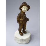 A French Bronze and Ivory Study of a Boy in Clogs Carrying Book. Stood on a Marble Plinth.