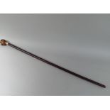 A 19th Century Continental Walking Stick with a Carved Handle Modelled as a Boys Head with Rolling
