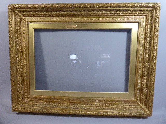 A Large Victorian Gilt Picture Frame with Moulded Decoration, Outer Measurement 89x113cms.