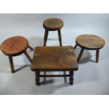 A Collection of Four 19th Century Milking Stools with Elm Tops and Turned Legs.