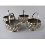 A Collection of Four Victorian SIlver Salts with Loop Carrying Handles.
