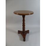 A Late 19th Century Mahogany Wine Table with Turned Support and Tri-form Base.