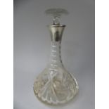 A Silver Topped Cut Glass Decanter,