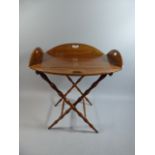A 19th Century Mahogany Butlers Tray with Hinged Fold Down Sides on Wavy Turned Stand.