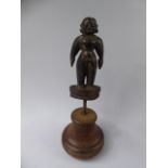 A 19th Century South Indian Carved Hardwood Putali Figure, Mounted on a Later Iron and Wood Plinth.