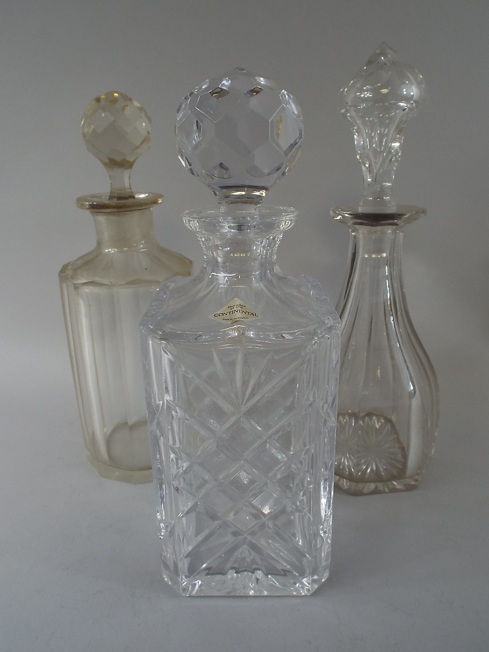 Three Glass Decanters Including Edinburgh Crystal Continental