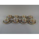 A Mid 20th Century Japanese Hand Painted Coffee Set comprising Eight Cups and Saucers Decorated