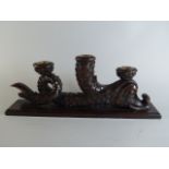 An Early 19th Century Carved Oak Candlestick Modelled as a Regency Style Dolphin.