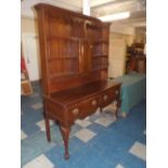 An Edwardian Oak Dresser with Two Drawers to Base, Raised Plate Rack and Front Cabriole Legs,