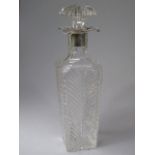 A Heavy Hand Blown Cut Glass Silver Mounted Decanter of Square Tapering Form.