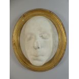 A 19th Century Plaster Cast Death Mask of an Unknown Gentleman in an Oval Gilt Frame.