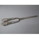 A Pair of Silver Handled Glove Stretchers.