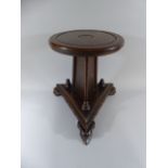 An Early 19th Century George III Oak Candlestand with a Circular Top over a Three Sided Platform