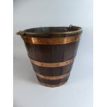 A 19th Century Copper Banded Oak Bucket of Coopered Construction. With Brass Carrying Handle.