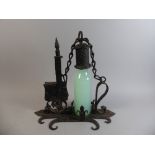 An Unusual Continental Lockable Iron Single Bottle Tantalus,