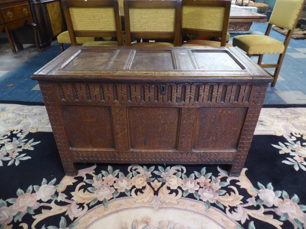 An Early Oak Three Panel Coffer Chest with Hinged Lid and Blind Carved Supports,