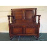 An Edwardian Oak Monk's Bench with Sliding Table Top,